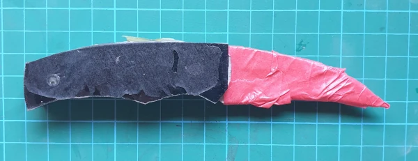 Knife blade wrapped in masking tape